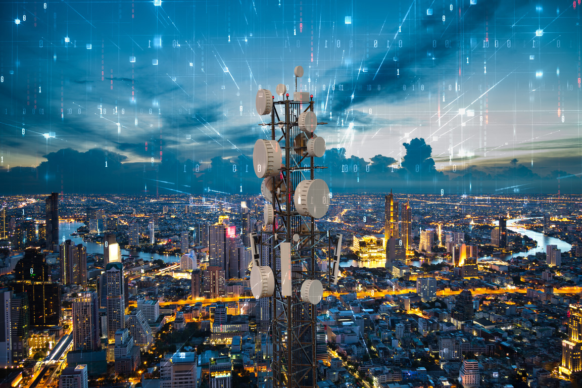 Telecommunication tower with 5G cellular network antenna on night city background, Digital big data concept